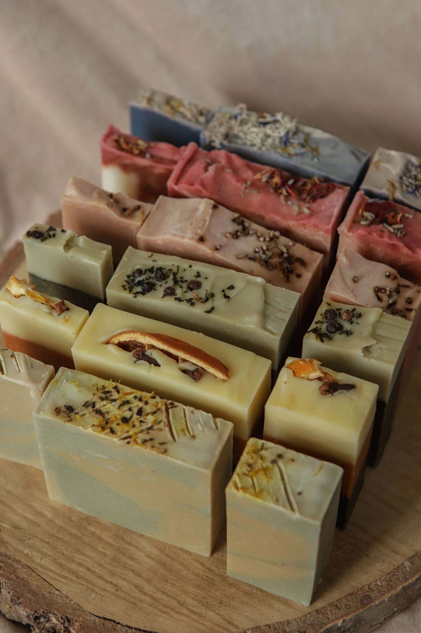 All 6 origin soaps in three different sizes — flora - red, pink/purple - heather, spice - orange, mentha - yellow, fern - green, moss - blue