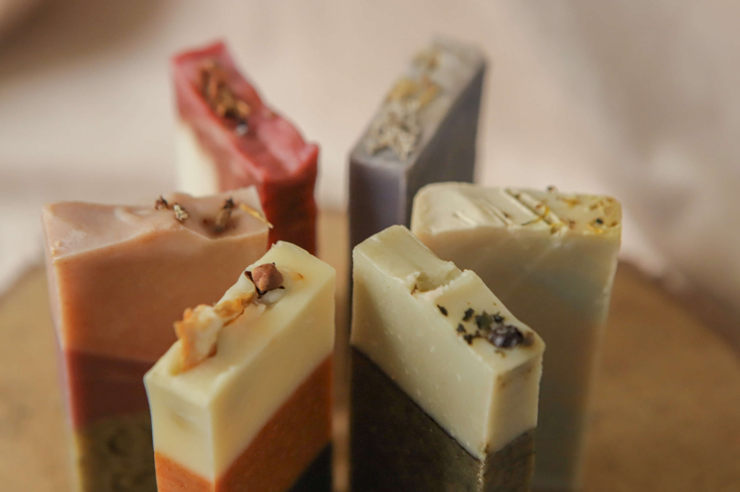 All 6 origin soaps in thin sizes — flora - red, pink/purple - heather, spice - orange, mentha - yellow, fern - green, moss - blue