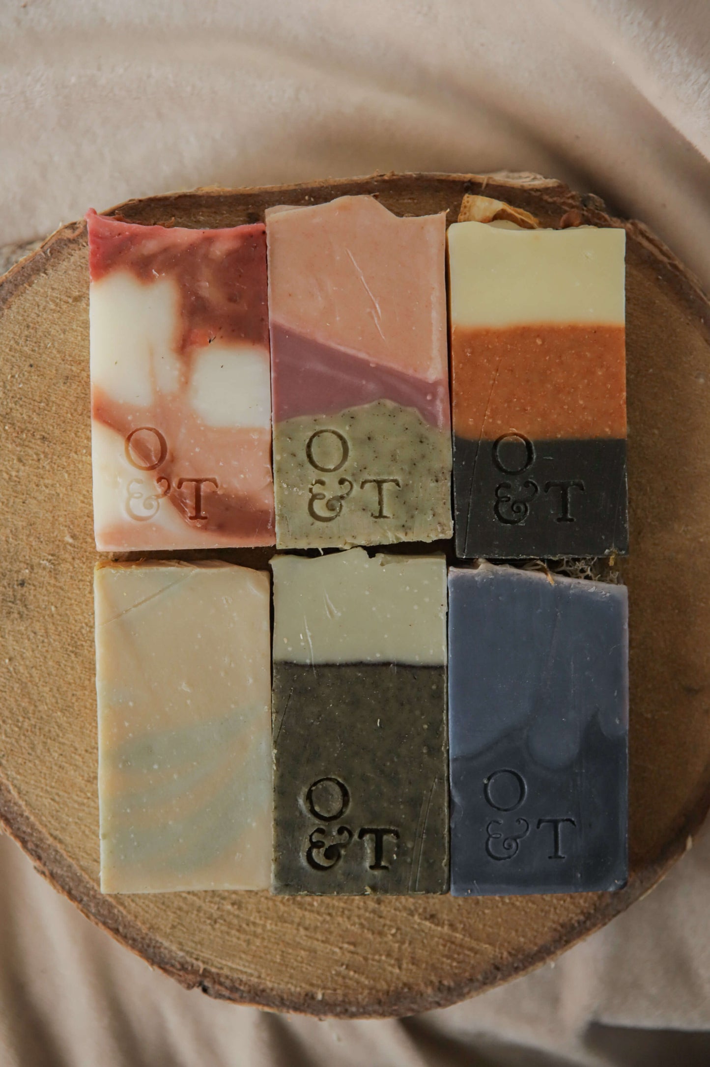 All 6 origin soaps in thin sizes — flora - red, pink/purple - heather, spice - orange, mentha - yellow, fern - green, moss - blue