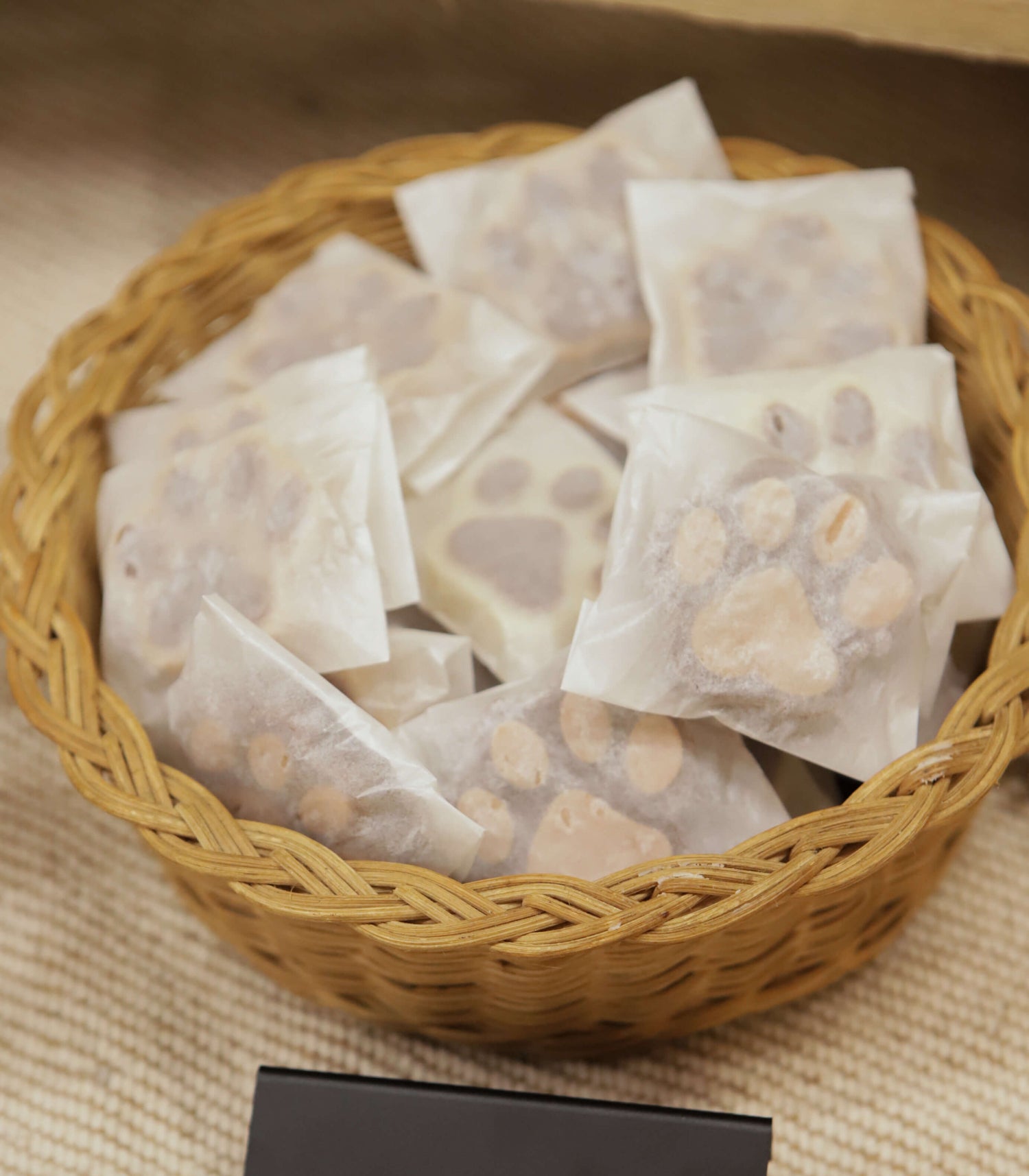 dog soaps in their packets in a woven basket at a market