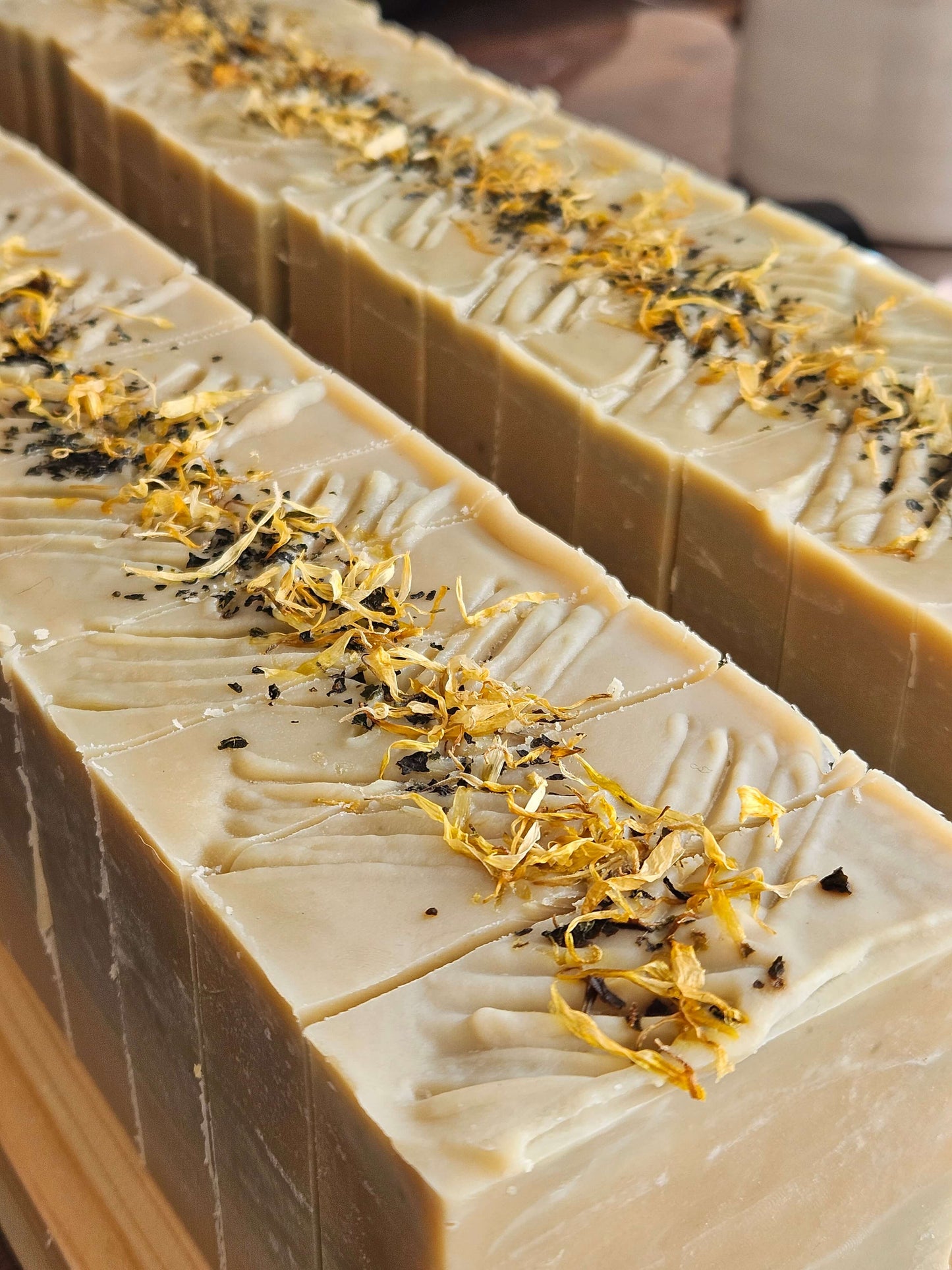 green and yellow mentha soap loaf cut into individual soaps