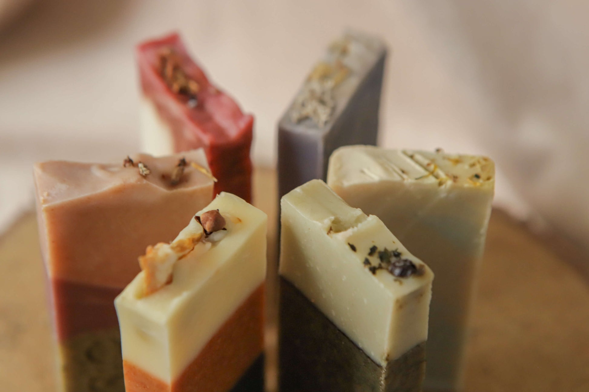 All 6 origin soaps in thin sizes — flora - red, pink/purple - heather, spice - orange, mentha - yellow, fern - green, moss - blue