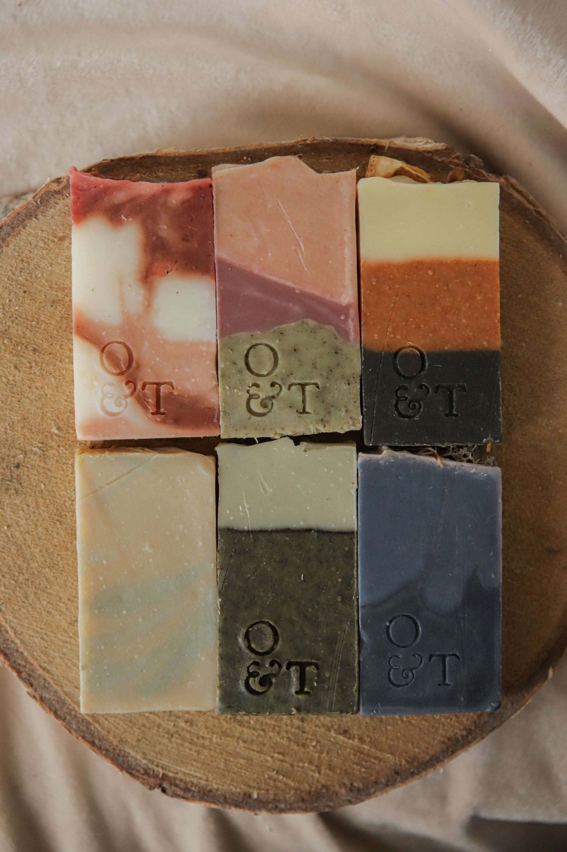All 6 origin soaps in thin sizes — flora - red, pink/purple - heather, spice - orange, mentha - yellow, fern - green, moss - blue