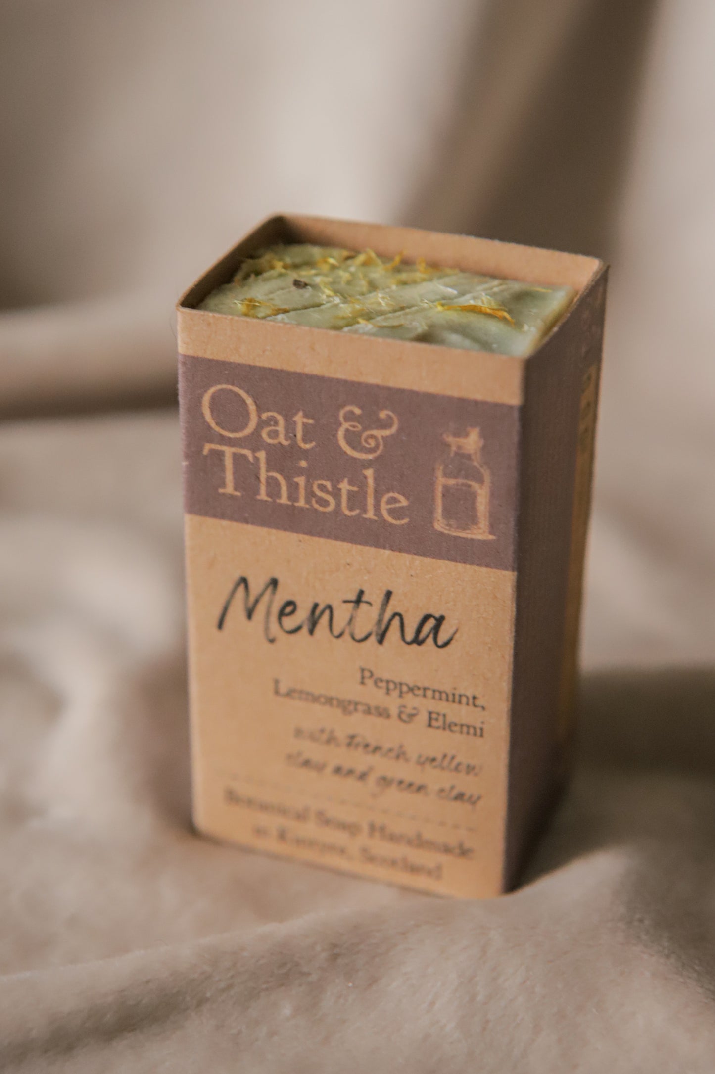 half mentha soap bar in packaging
