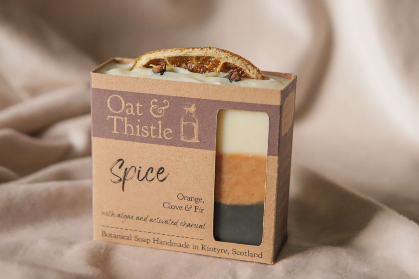 Spice soap bar in packaging, black orange and creamy white