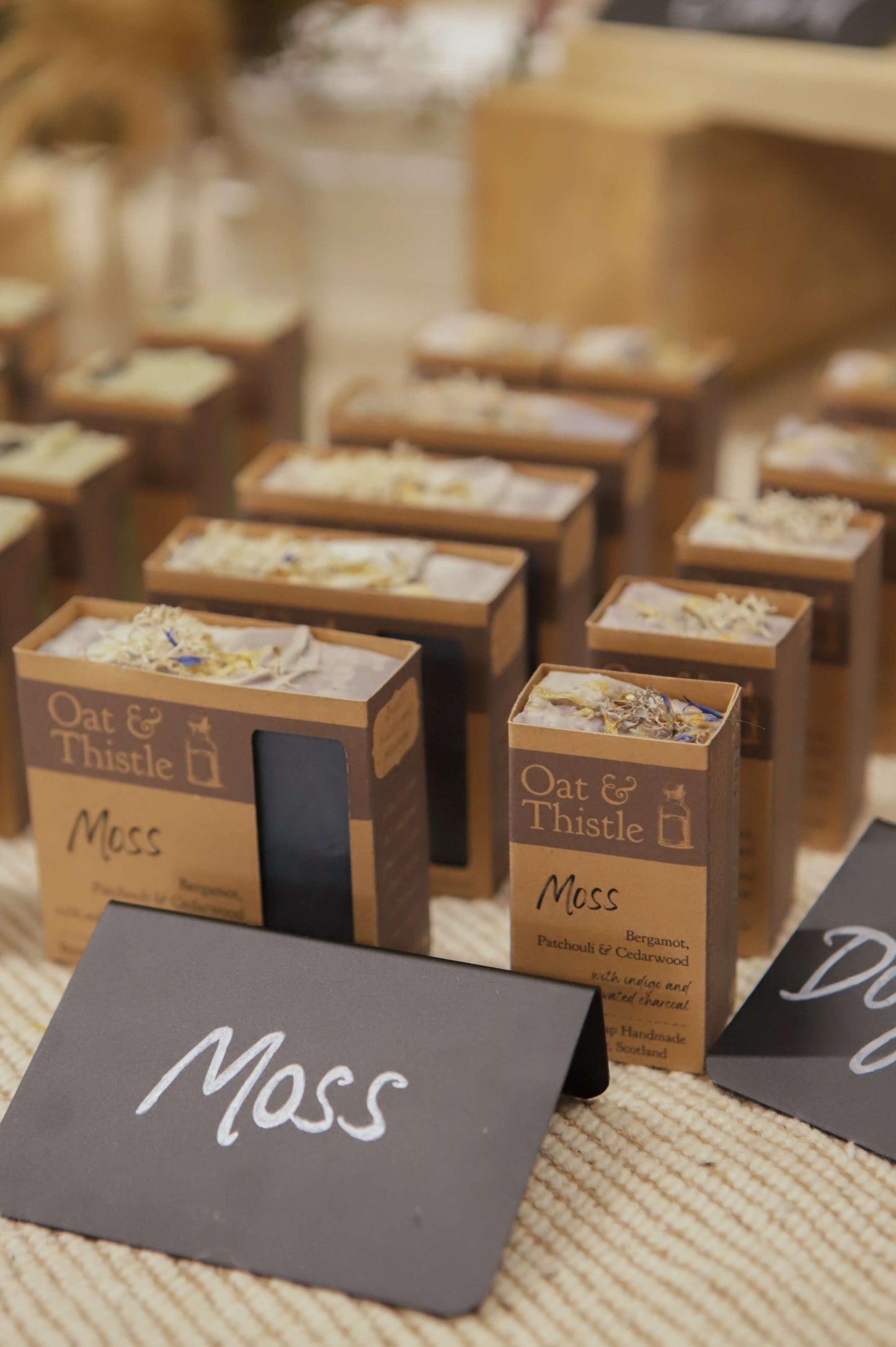 Moss soap in packaging on market table