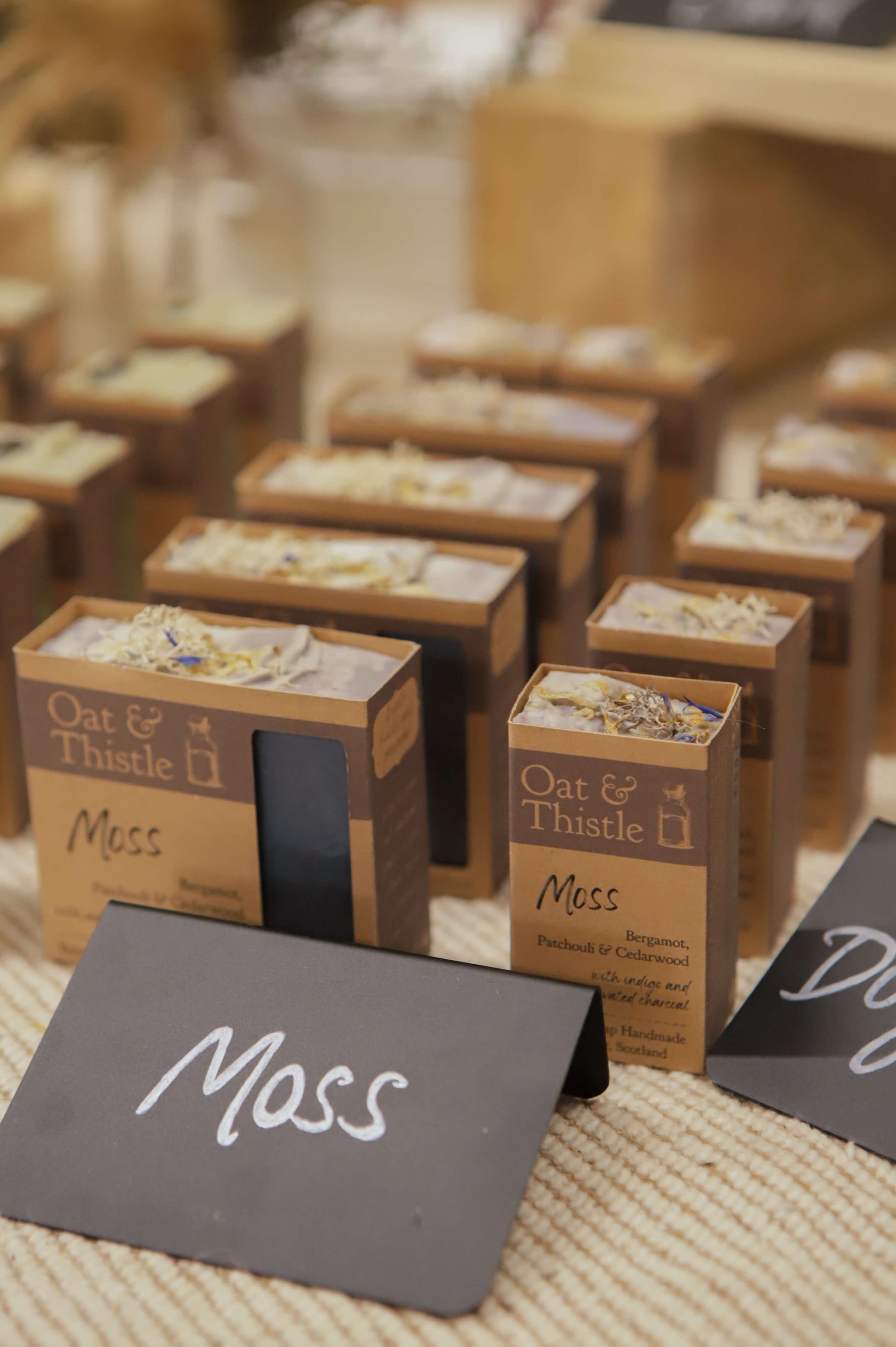 Moss soap in packaging on market table