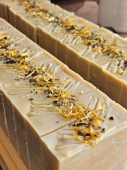 green and yellow mentha soap loaf cut into individual soaps