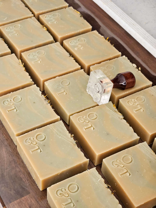 Mentha soap bars on worktop getting stamped with their o&t logo