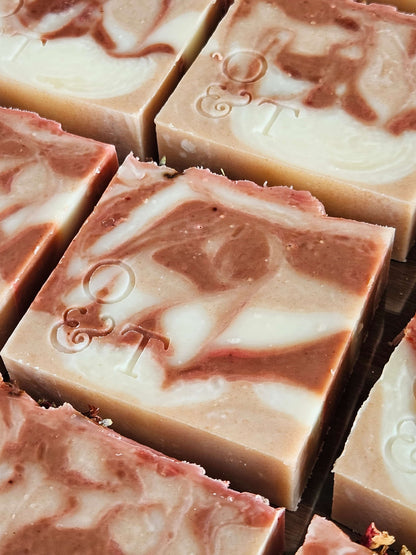Large close up of flora soap bars with stamped logo