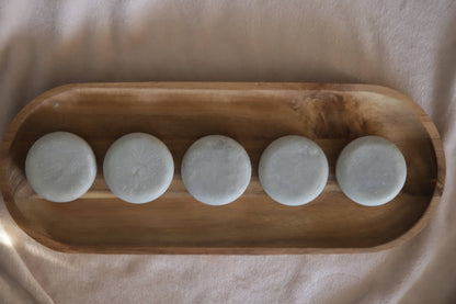 Blue heather lotion bars on wooden tray
