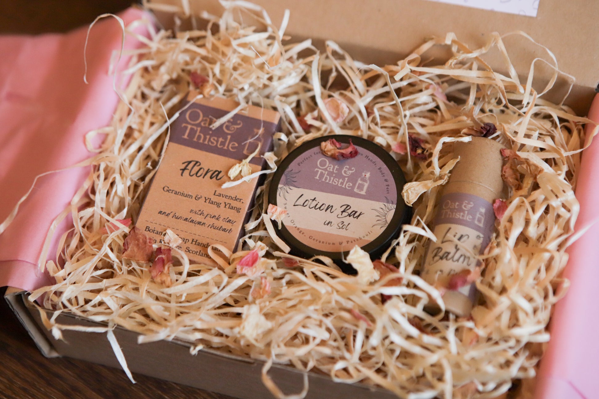 seasonal apothecary gift box, soap lotion bar and lip balm nestled in wood wool gift box