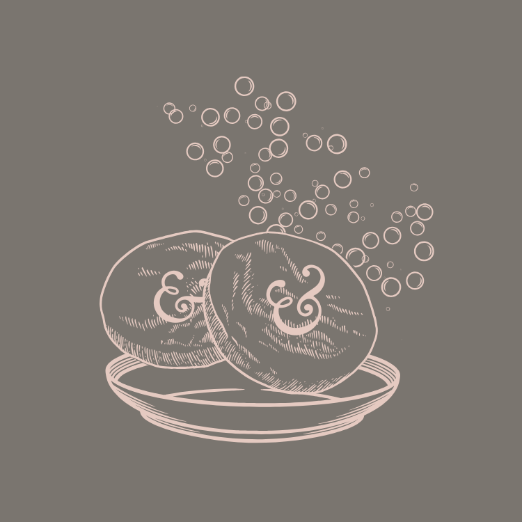 line drawing of shampoo bars on dish with bubbles behind them